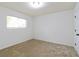This bedroom features a window that provides plenty of natural light, as well as neutral carpeting at 3665 Chestnut Dr # A2, Atlanta, GA 30340