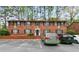 Attractive two-story brick apartment building with manicured landscaping, plenty of parking, and black window shutters at 3665 Chestnut Dr # A2, Atlanta, GA 30340