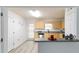 Kitchen features blond wood cabinets, stainless steel appliances, gray countertops, and hardwood flooring at 3665 Chestnut Dr # A2, Atlanta, GA 30340