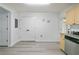 Bright kitchen features light cabinets, grey countertop, grey vinyl flooring and an access door at 3665 Chestnut Dr # A2, Atlanta, GA 30340