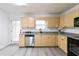 Kitchen showcasing blonde wood cabinets, stainless steel appliances, and gray countertops at 3665 Chestnut Dr # A2, Atlanta, GA 30340