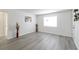Living room features neutral paint and hardwood floors, a window, and decorative accents at 3665 Chestnut Dr # A2, Atlanta, GA 30340