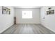 View of a naturally lit living room featuring neutral paint and hard wood floors at 3665 Chestnut Dr # A2, Atlanta, GA 30340