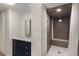 Elegant bathroom with a tiled shower, stylish vanity, and painted brick accents at 591 E Morningside Ne Dr, Atlanta, GA 30324