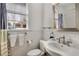 This bathroom features a window, toilet, sink, and subway tile at 591 E Morningside Ne Dr, Atlanta, GA 30324