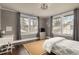 This bedroom features hardwood floors, multiple windows, and a gray color scheme at 591 E Morningside Ne Dr, Atlanta, GA 30324