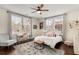 Sunlit bedroom with ceiling fan, neutral decor, and windows offering ample natural light at 591 E Morningside Ne Dr, Atlanta, GA 30324