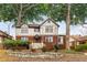 Charming two-story home boasting a brick foundation, stone accents, and a welcoming entryway at 591 E Morningside Ne Dr, Atlanta, GA 30324