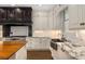 Bright kitchen with white cabinets, marble countertops, and a large copper sink overlooking the backyard at 591 E Morningside Ne Dr, Atlanta, GA 30324