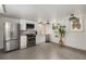 Modern kitchen features stainless steel appliances, white cabinets, and stylish lighting at 591 E Morningside Ne Dr, Atlanta, GA 30324