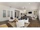 Expansive living room with hardwood floors, recessed lighting, and multiple seating areas at 591 E Morningside Ne Dr, Atlanta, GA 30324