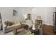 Open living area featuring a large sofa, hardwood floors and natural light at 591 E Morningside Ne Dr, Atlanta, GA 30324