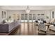 Bright living room boasts hardwood floors, elegant chandelier, and French doors to outdoors at 591 E Morningside Ne Dr, Atlanta, GA 30324