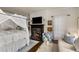 A beautifully decorated main bedroom with a canopy bed, fireplace, and sitting area at 591 E Morningside Ne Dr, Atlanta, GA 30324