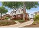 Rear exterior view of home, showing landscaped yard, driveway and detached garage at 591 E Morningside Ne Dr, Atlanta, GA 30324