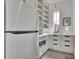 Well-organized pantry with ample shelving, drawers, microwave, and great lighting at 205 Thomas Cir, Roswell, GA 30075