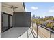 Enjoy the city skyline view from this modern balcony, complete with ceiling fan and sleek black sliding glass doors at 223 16Th Nw St # 8, Atlanta, GA 30363