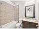 Bathroom featuring tiled tub and shower combination and granite vanity at 223 16Th Nw St # 8, Atlanta, GA 30363