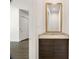 Modern powder bathroom with granite countertop, dark cabinetry and stylish mirror at 223 16Th Nw St # 8, Atlanta, GA 30363