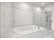 Elegant bathroom features a modern tub and frameless glass shower at 223 16Th Nw St # 8, Atlanta, GA 30363