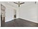 Expansive bedroom features sleek ceiling fan and dark hardwood floors at 223 16Th Nw St # 8, Atlanta, GA 30363
