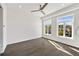 Light-filled bedroom boasts hardwood floors and exterior views through windows at 223 16Th Nw St # 8, Atlanta, GA 30363
