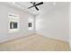 Bright bedroom featuring neutral carpet, white walls, recessed lighting, and two windows offering plenty of natural light at 223 16Th Nw St # 8, Atlanta, GA 30363