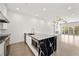 Modern kitchen featuring a large island with waterfall edge countertop, gas cooktop at 223 16Th Nw St # 8, Atlanta, GA 30363