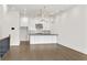 Open concept kitchen with black and white marble countertops and modern lighting at 223 16Th Nw St # 8, Atlanta, GA 30363