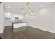 Open concept kitchen and living room featuring modern island and lighting at 223 16Th Nw St # 8, Atlanta, GA 30363