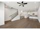 Open concept living area with staircase and view into modern kitchen at 223 16Th Nw St # 8, Atlanta, GA 30363