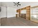 Open living room with modern built-in shelving and hardwood floors at 223 16Th Nw St # 8, Atlanta, GA 30363
