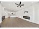 Open concept living room and kitchen with modern fireplace and stylish light fixture at 223 16Th Nw St # 8, Atlanta, GA 30363