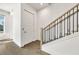 Modern staircase with wood and iron railing leading to the upper floor at 223 16Th Nw St # 8, Atlanta, GA 30363