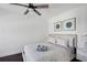 Comfortable bedroom with a queen bed, modern ceiling fan, and stylish decor at 215 Piedmont Ne Ave # 2201, Atlanta, GA 30308