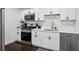 Modern kitchen featuring stainless steel appliances, white cabinets, and stylish hardware at 215 Piedmont Ne Ave # 2201, Atlanta, GA 30308