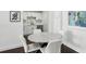 Eat-in kitchen features modern cabinetry, marble backsplash, and stainless steel appliances at 215 Piedmont Ne Ave # 2201, Atlanta, GA 30308