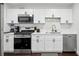 Modern kitchen with white cabinets, stainless steel appliances, and granite countertops at 215 Piedmont Ne Ave # 2201, Atlanta, GA 30308