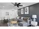 Living Room area with modern ceiling fan, area rug, couch, and decor at 215 Piedmont Ne Ave # 2201, Atlanta, GA 30308