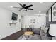 Living Room area with modern ceiling fan, area rug, couch, and decor at 215 Piedmont Ne Ave # 2201, Atlanta, GA 30308