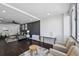 Inviting living room with a comfortable gray sectional, dark wood floors, and bright, airy atmosphere at 215 Piedmont Ne Ave # 2201, Atlanta, GA 30308