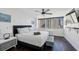 Cozy main bedroom with natural light, TV, and hardwood floors at 215 Piedmont Ne Ave # 2201, Atlanta, GA 30308