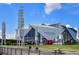 View of Mercedes-Benz Stadium in Atlanta on a sunny day with blue skies and an expansive entry plaza at 215 Piedmont Ne Ave # 2201, Atlanta, GA 30308