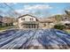 Private backyard featuring a covered pool, patio area, lush lawn, and mature trees at 4833 Village North Ct, Atlanta, GA 30338
