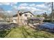 Charming backyard with a covered pool, connected sunroom, and well-maintained lawn at 4833 Village North Ct, Atlanta, GA 30338
