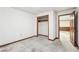 Basement room with white walls, stained concrete floor, empty closet and doorway at 4833 Village North Ct, Atlanta, GA 30338