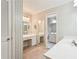 Bathroom featuring a double sink vanity, dressing table and mirror at 4833 Village North Ct, Atlanta, GA 30338