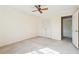 Bedroom with a ceiling fan, neutral walls and carpet, and an closet with double doors at 4833 Village North Ct, Atlanta, GA 30338