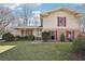Charming home with manicured lawn, red shutters, and inviting front porch at 4833 Village North Ct, Atlanta, GA 30338