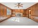 Cozy living room with stone fireplace, built-in cabinets, and soft natural light at 4833 Village North Ct, Atlanta, GA 30338